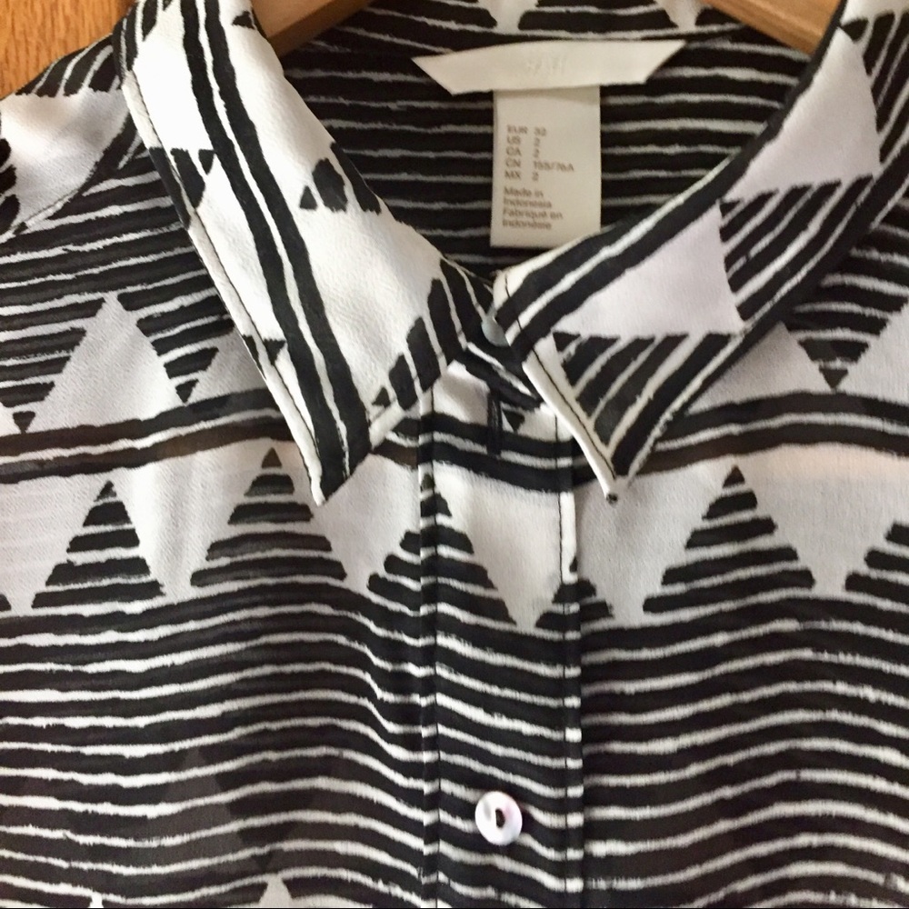 Sleeveless sheer black and white blouse